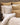 A gold damask print duvet cover with oxford flange and satin stitch border.